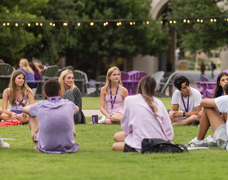 TCU students sitting in a circle at the commons 