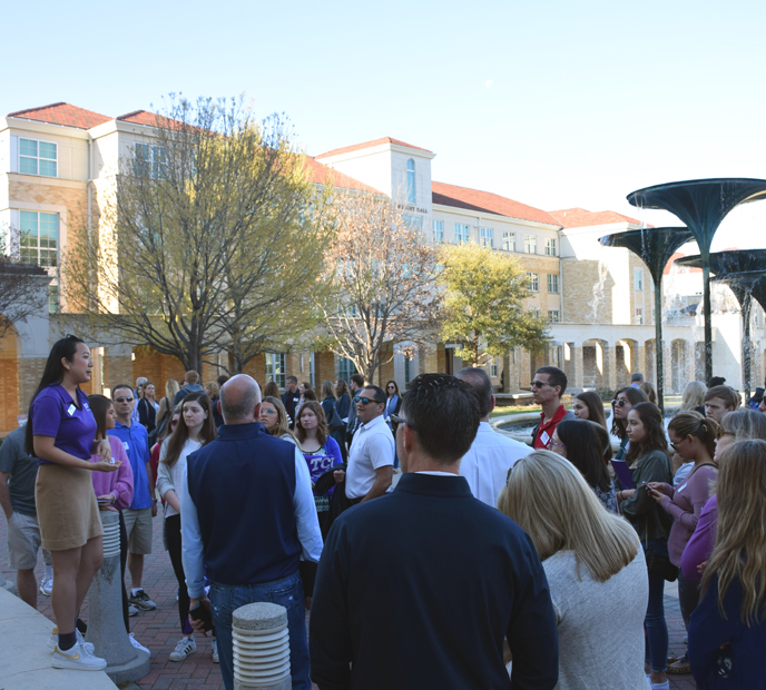 A TCU student leads a campus tour