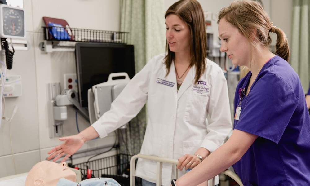 Nursing student working with faculty