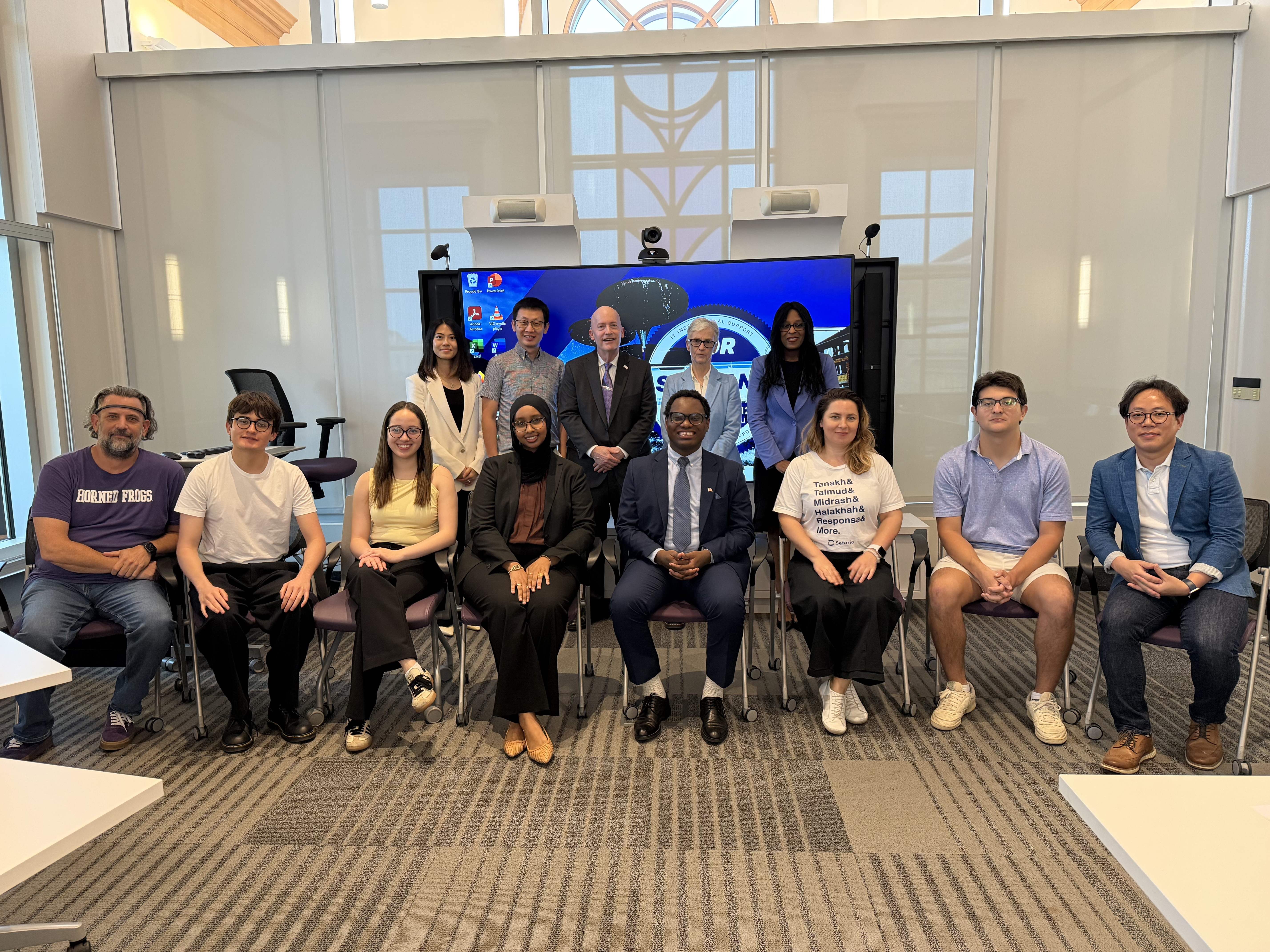TCU faculty and students involved in human-centered artificial intelligence programming gather for a group photo.