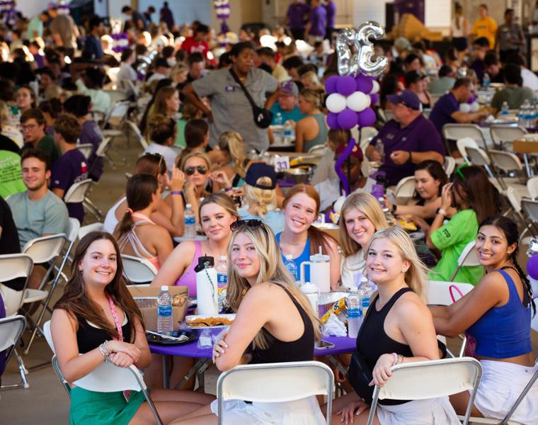 Students eating at Family Dinner for Frogs First