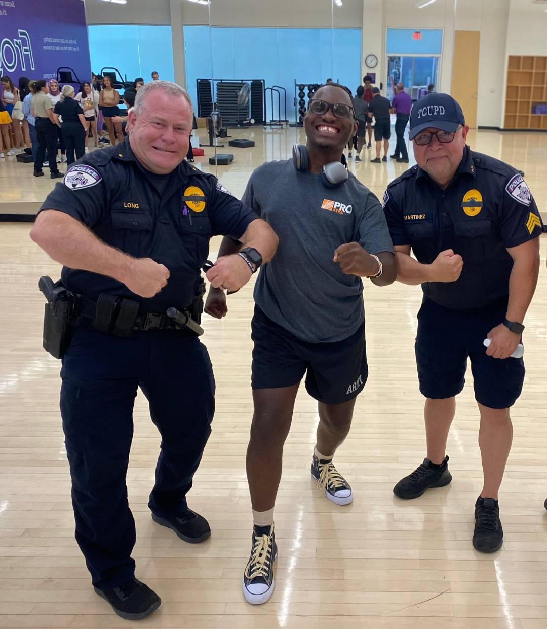 Happy Herman with TCU Police officers after a self-defense class