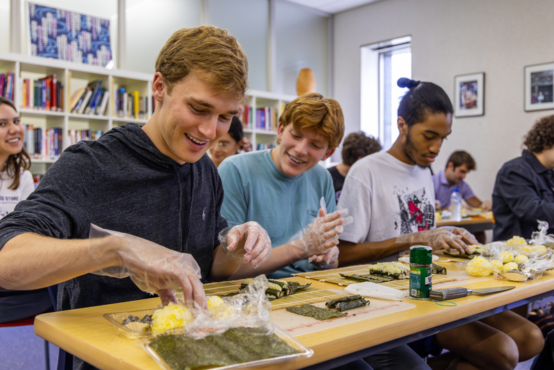 Honors College students making sushi in a class