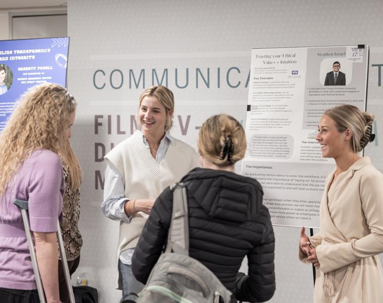 Image from a series of photos from the Bob Schieffer College of Communication Schieffer Showcase in Moudy. Students present their end-of-year research projects. Photo by James Anger on April 19, 2023.