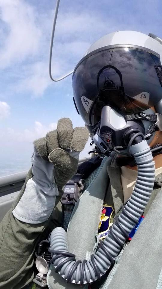 Pilot giving the Go Frogs sign