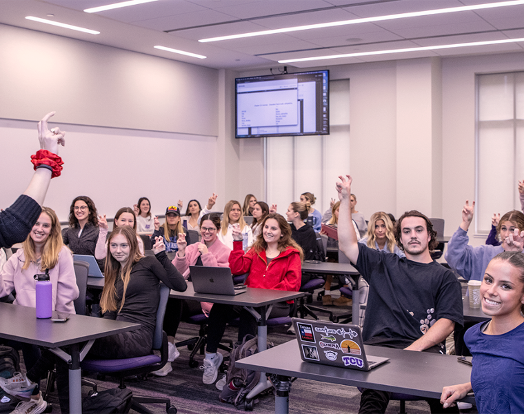 TCU Students in Basic ASL Class showing Horned Frogs Hand Gesture
