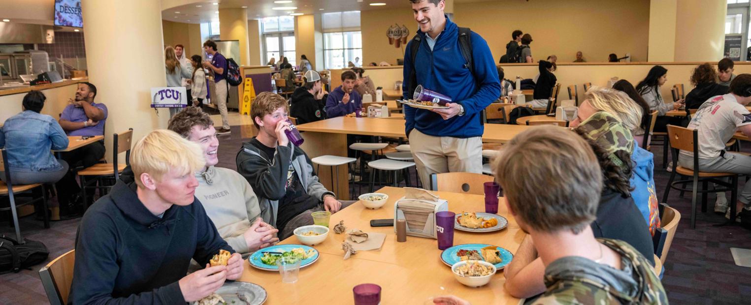 Students in Market Square enjoying a meal.