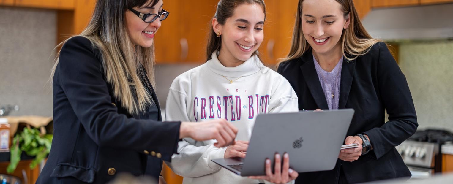 Female students completing nutrition lab