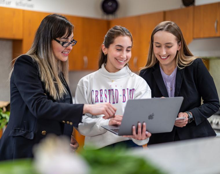 Female students completing nutrition lab