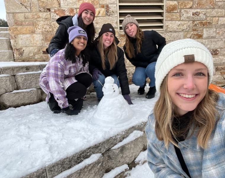 Colleen and friends making a snowman