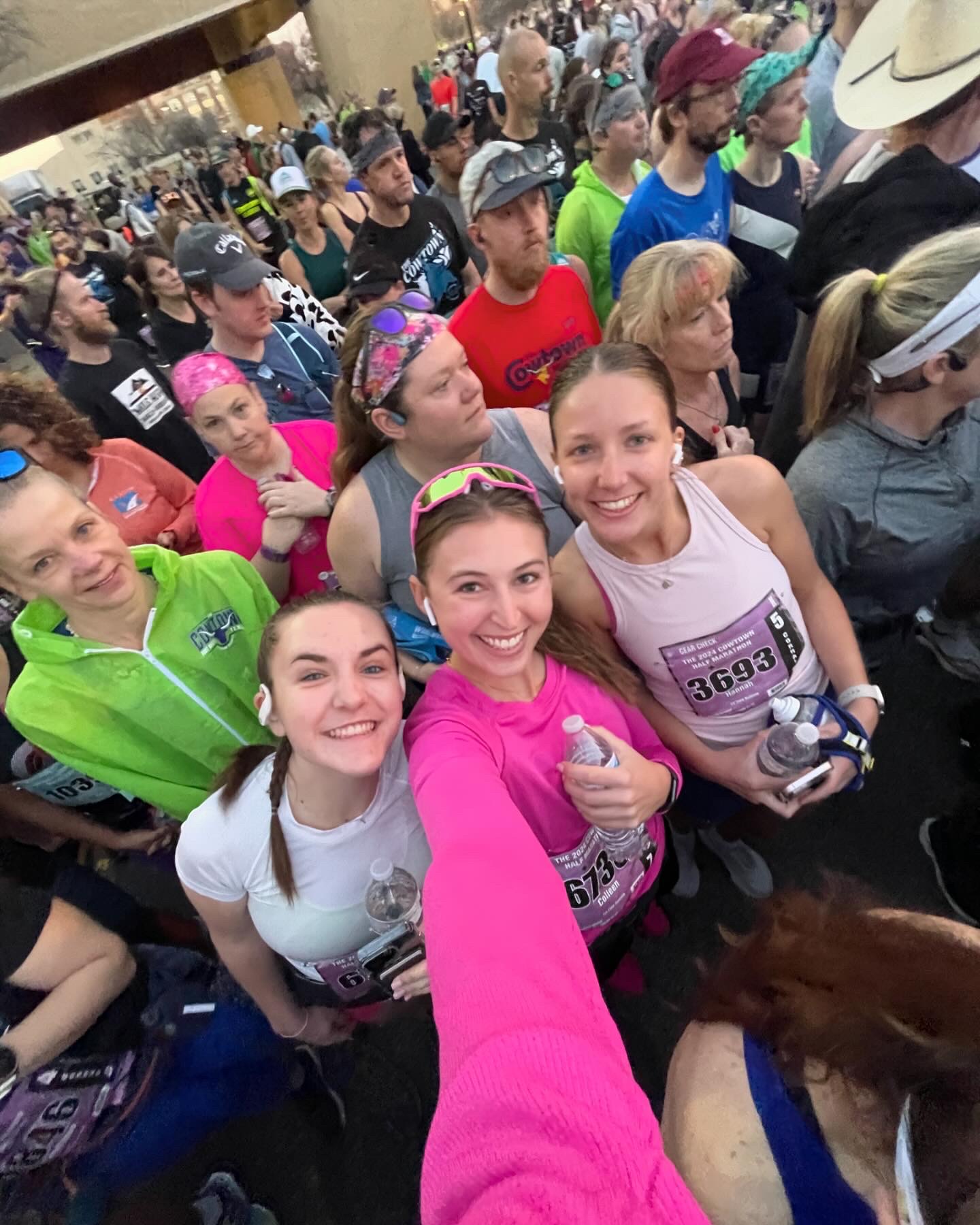 Colleen and other TCU students taking a selfie after running the Cowtown Marathon