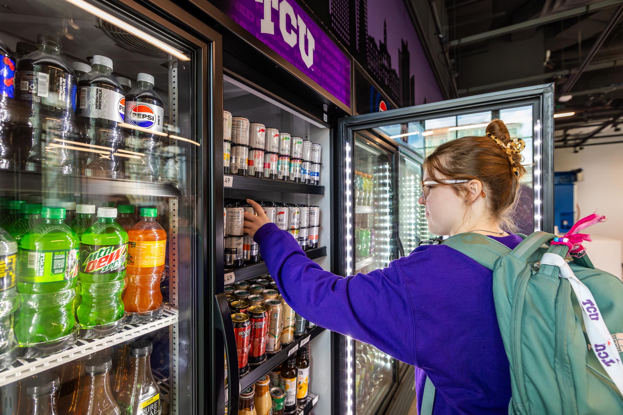 Students shop for food/beverage items at the Shoppe at Wright, January 17, 2025. The Shoppe is a TCU first: an Amazon Go store equipped with “Just Walk Out” technology that allows students to scan in, select items and leave without standing in line or interacting with a cashier. Photo by James Anger.