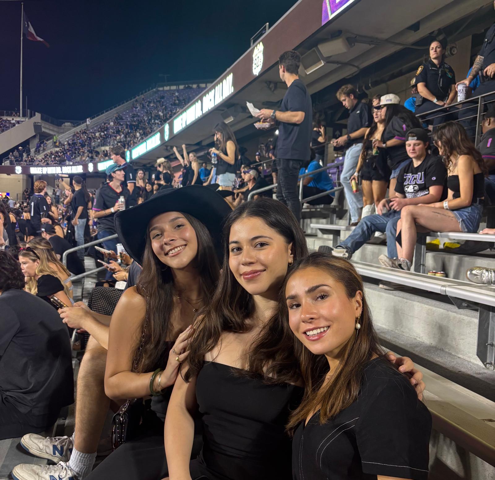 Lucia and her friends at a TCU football game