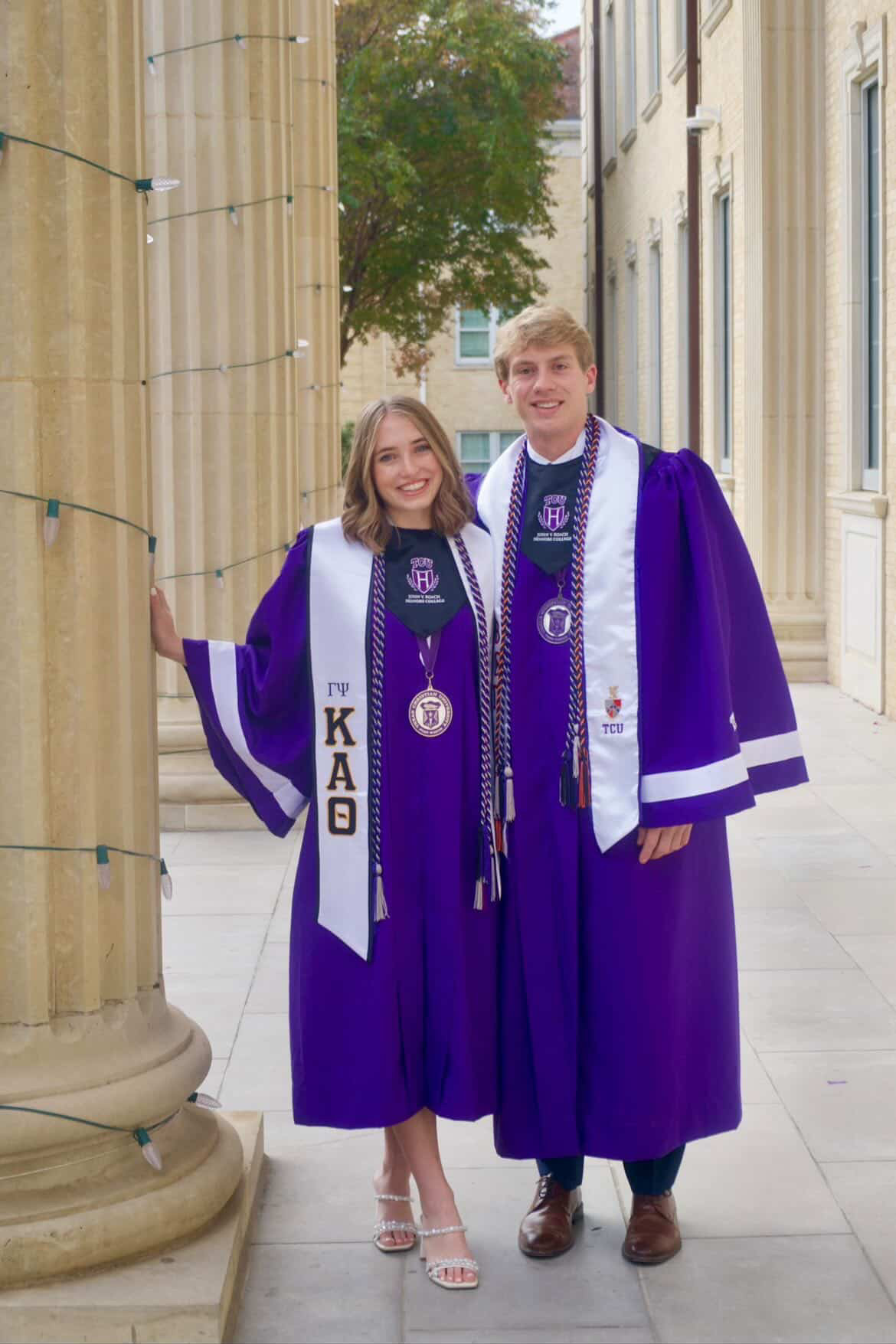 Gabby and Lance in their graduation regalia.