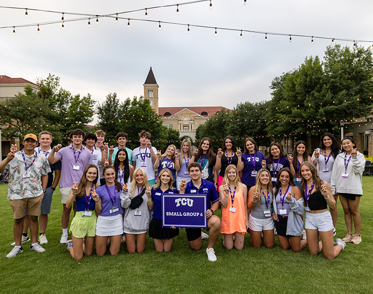 TCU students in small group four posing for a picture at the commons for Orientation 