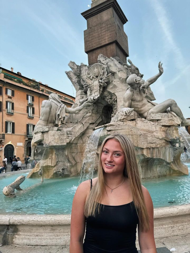 TCU student Reagan S.posing in Rome infront of a fountain