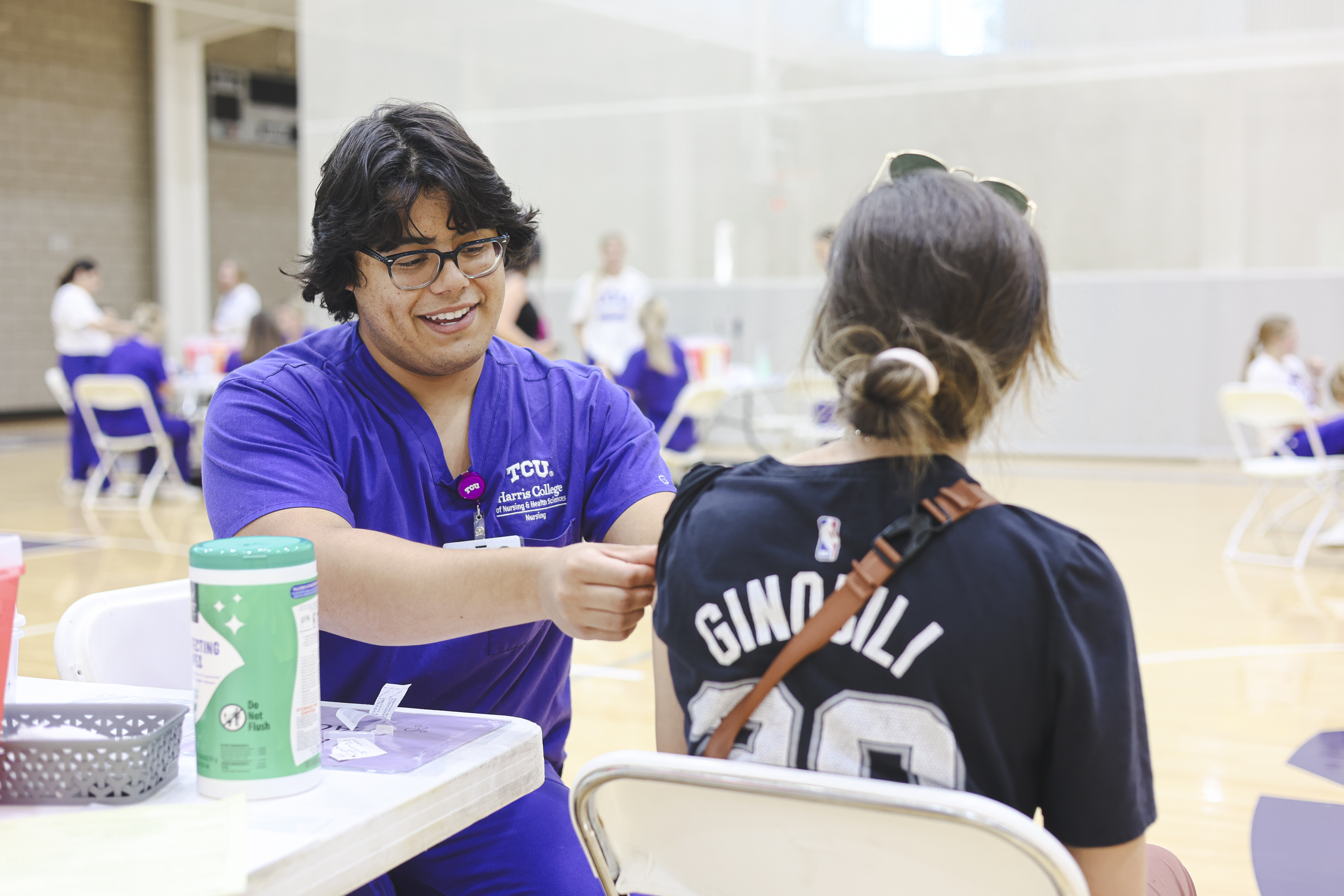 TCU Nursing student administers influenza vaccine