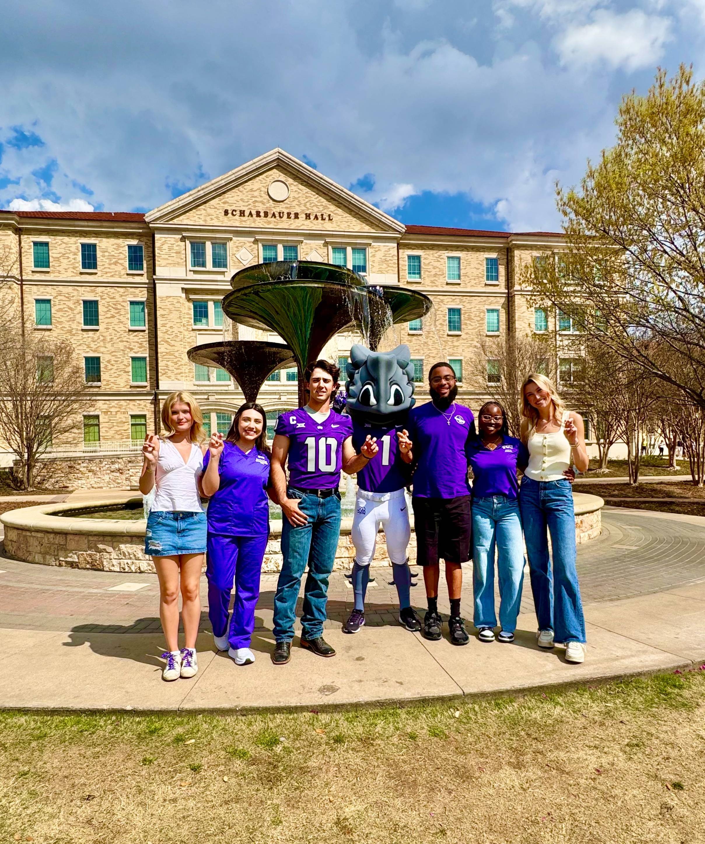 TCU students and SuperFrog at Frog Fountain