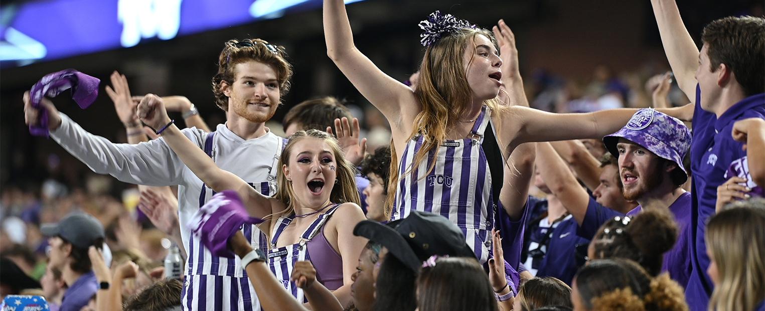 students cheering at a football game