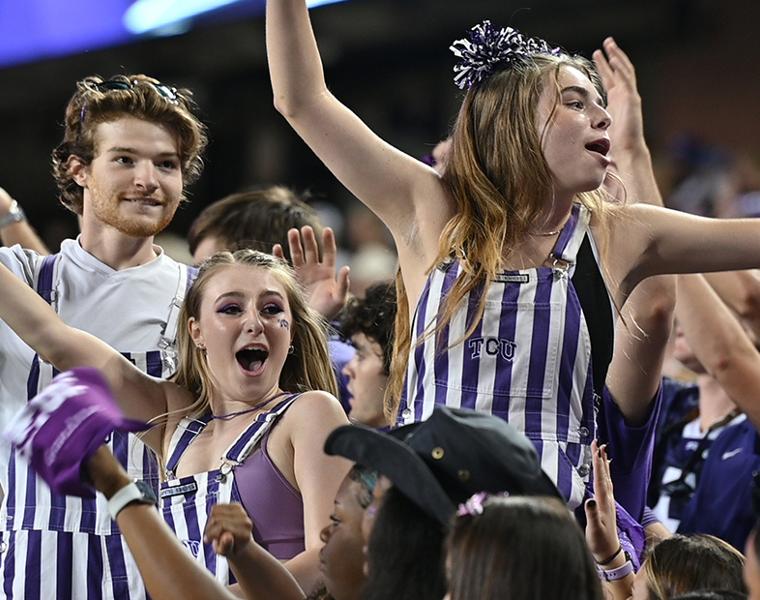 students cheering at a football game