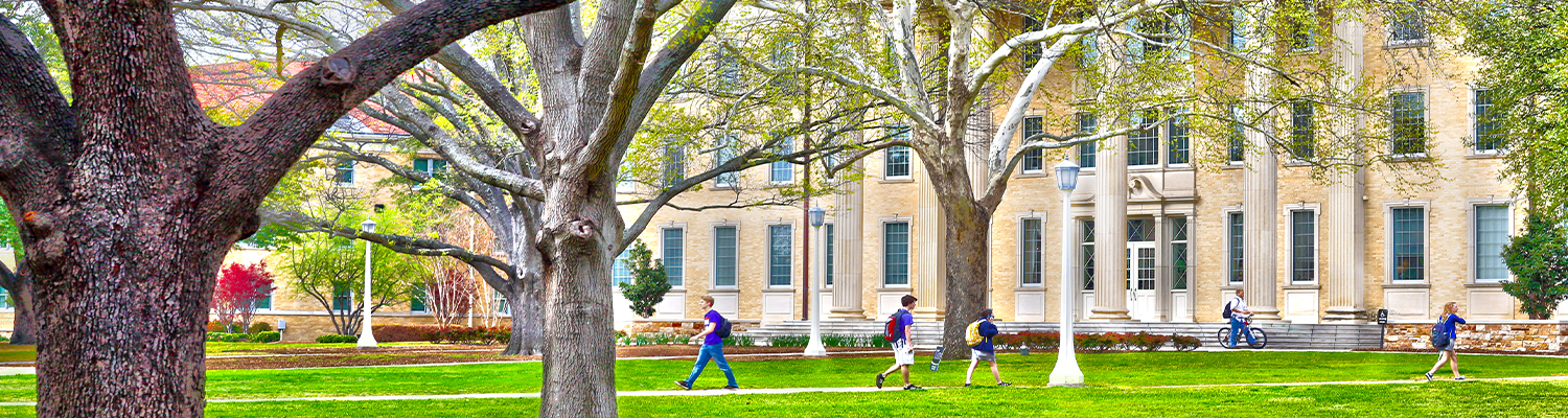 students walking through campus 