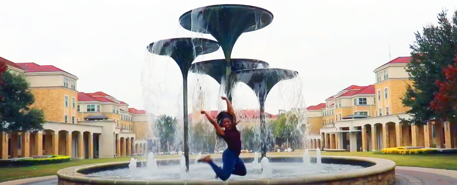 Queen jumping in front of Frog Fountain